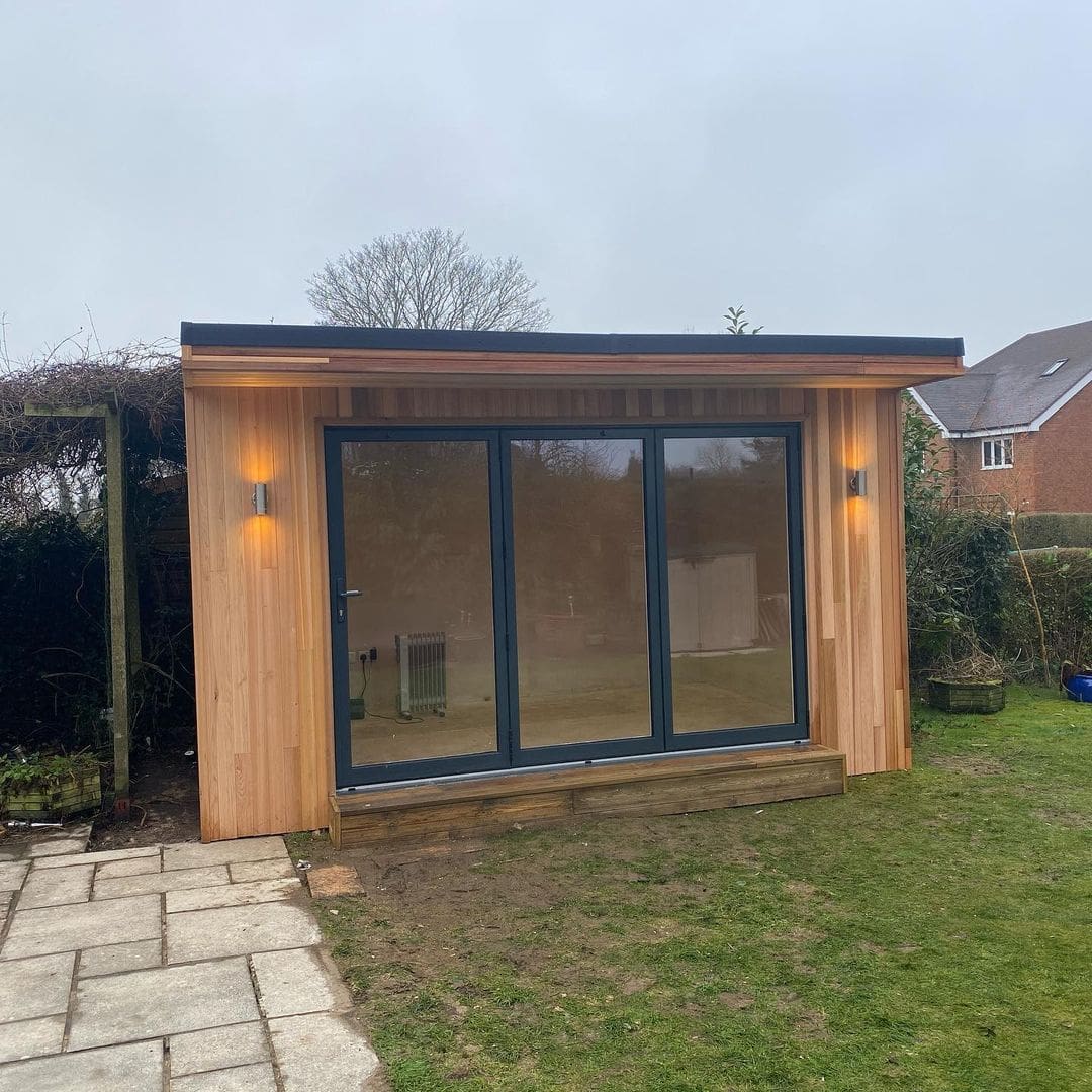 small garden pod with aluminium bifold doors