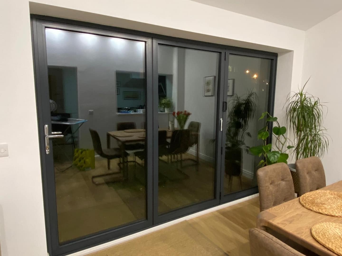 bifold door in dining room with modern interior