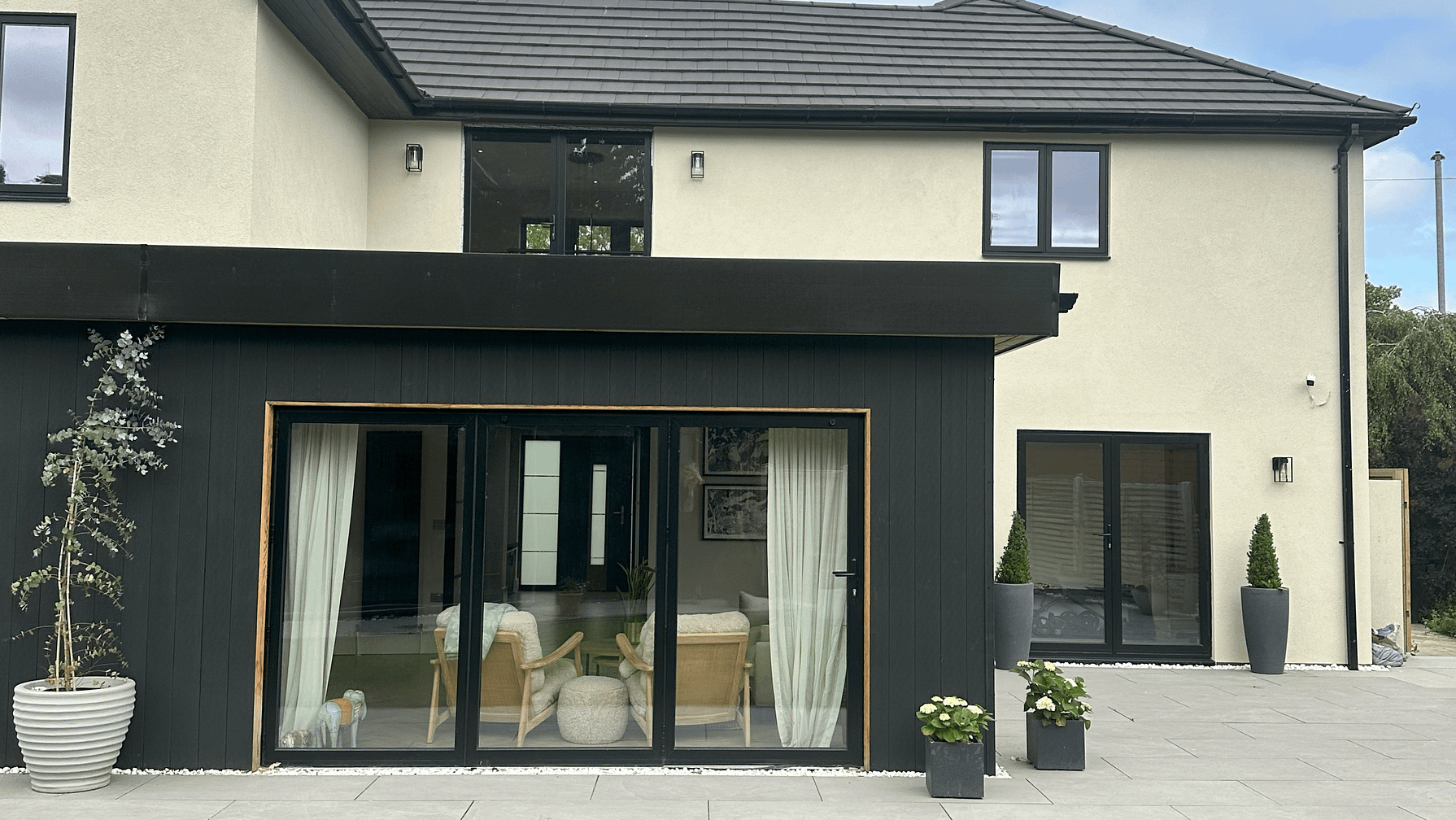 3 pane bifold door with aluminium windows and a french door