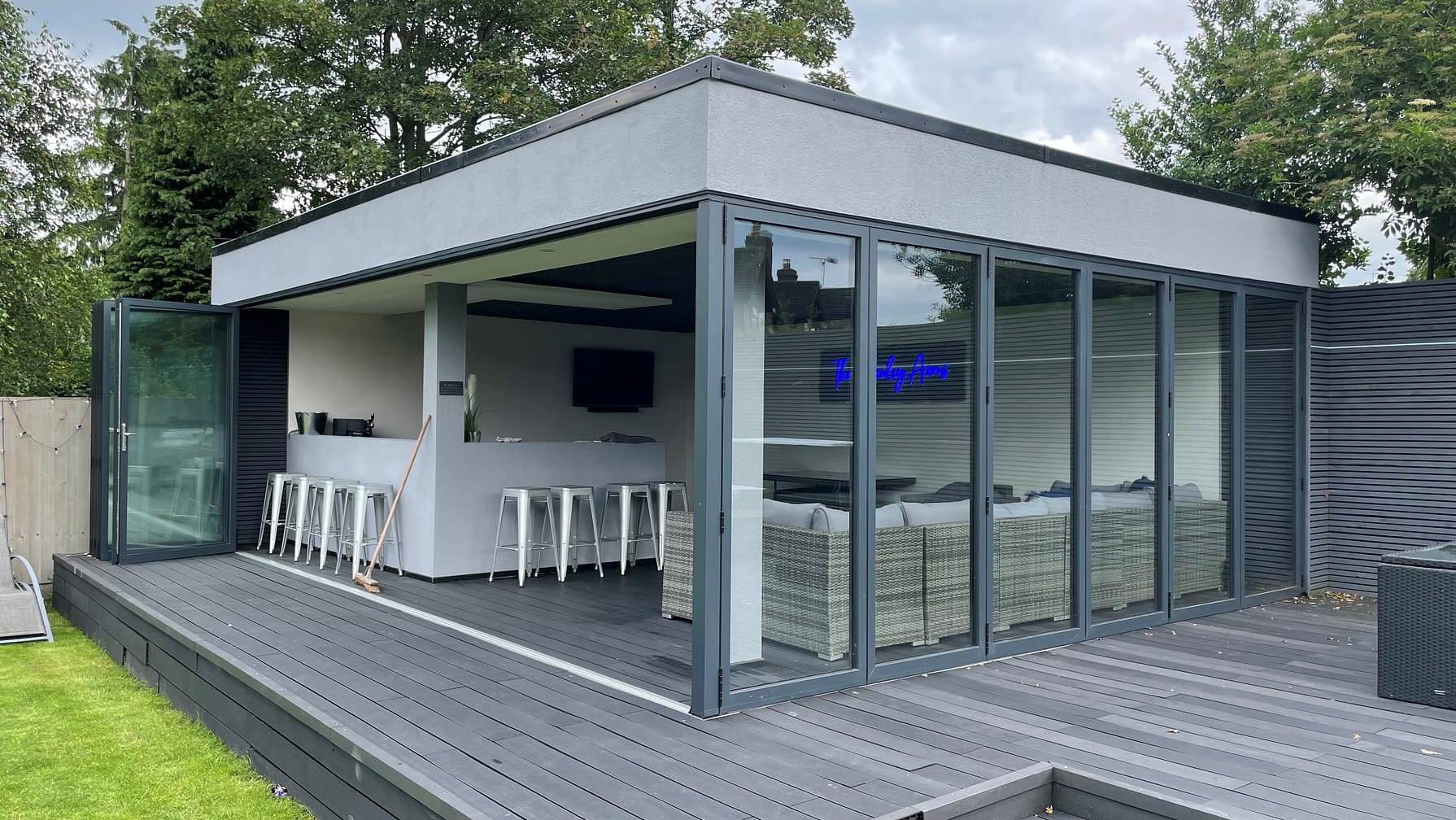 anthracite grey bifold doors with floating corner post in garden bar