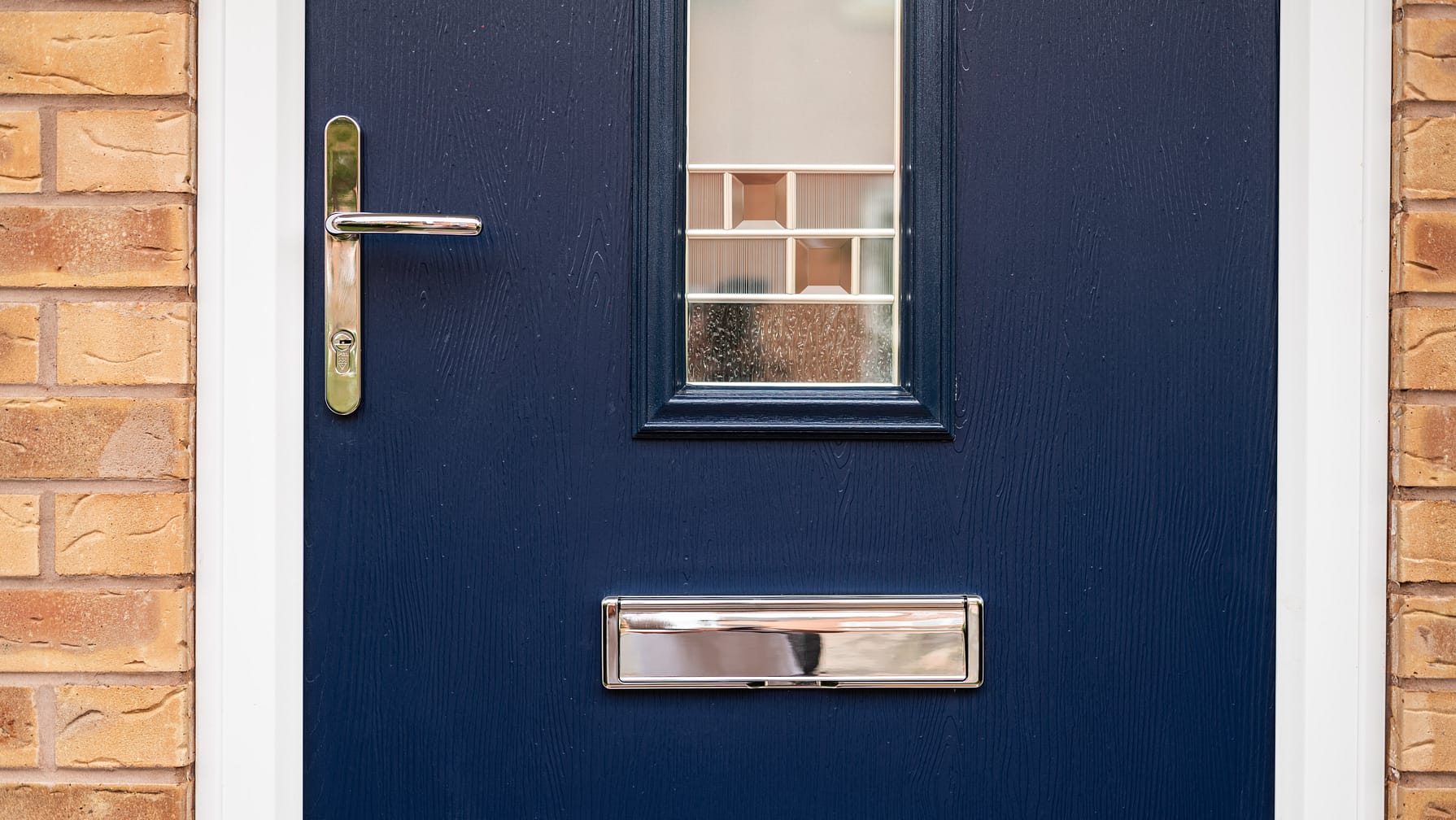 blue composite door close up with stainless steel hardware