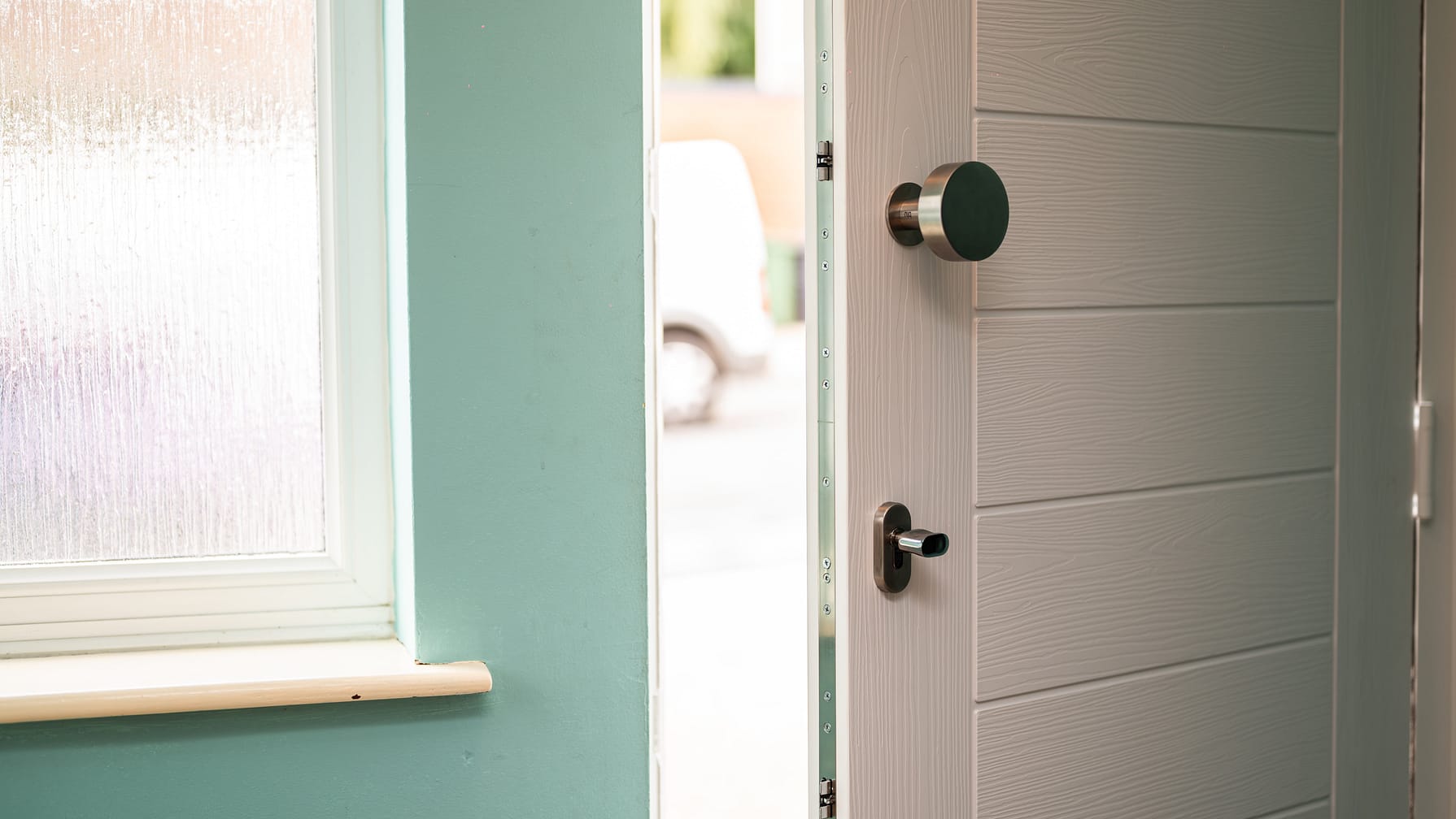 close up composite door from interior with door pull