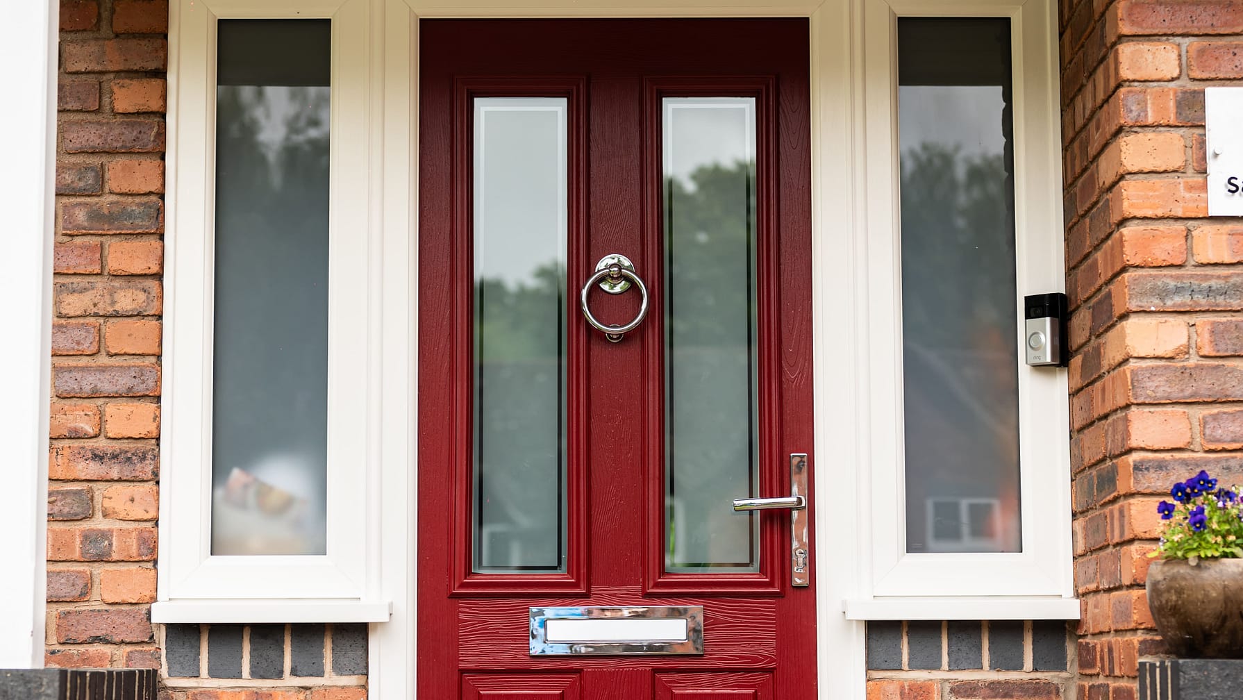 red composite door with stainless steel hardware and side panels