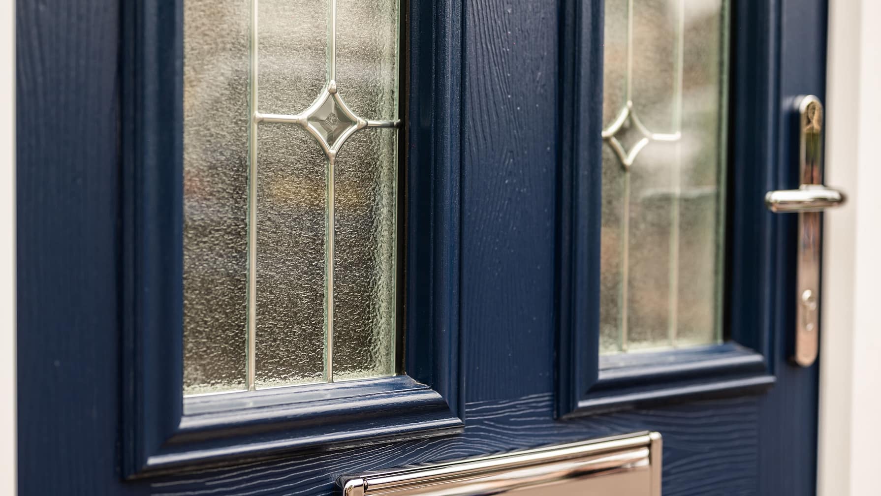 composite door close up with decorative glass
