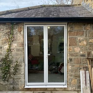 aluminium french door on stone building