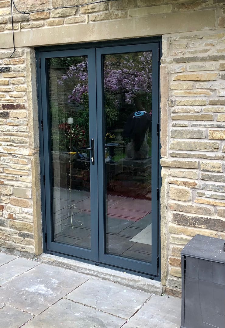 anthracite grey french door on stone building