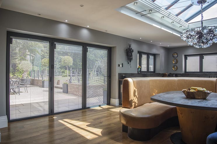 integral blinds in a bifold door and windows in kitchen diner