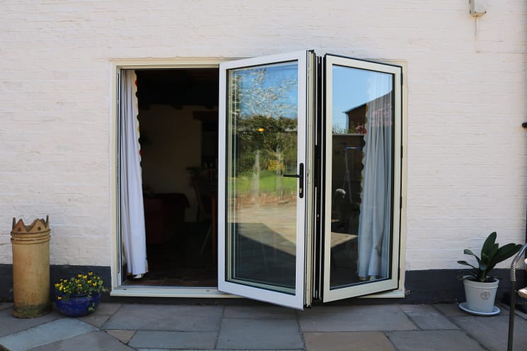 slimline aluminium bifold door in white