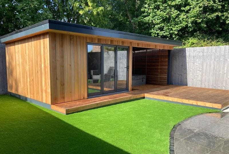 large garden hot tub room with 3 pane aluminium bifold doors