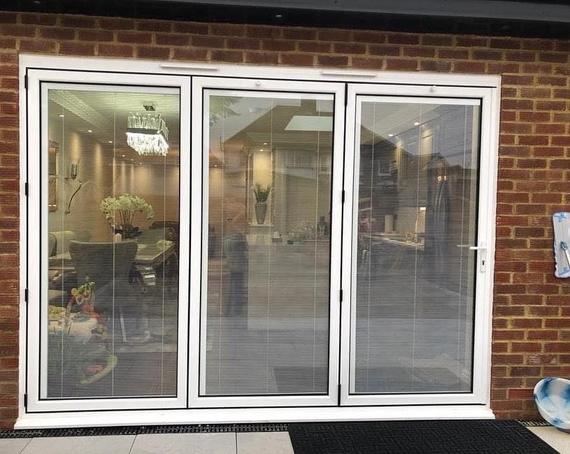 white aluminium bifold door with integral blinds
