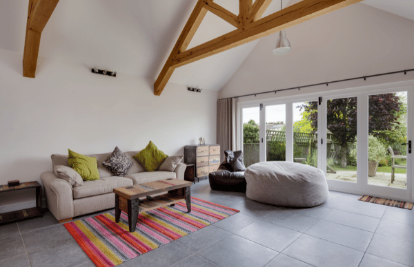white bifolding doors in contemporary living room