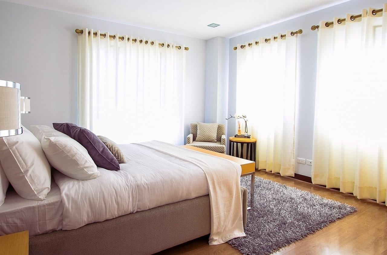 bedroom with sheer curtains