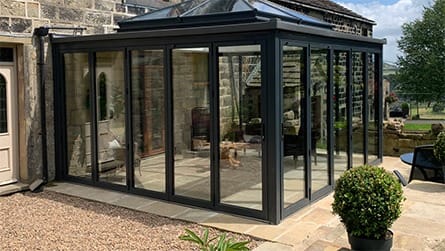 conservatory made using aluminium bifold doors